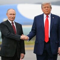 Donald Trump and Vladimir Putin walking side-by-side at the Alaska summit.