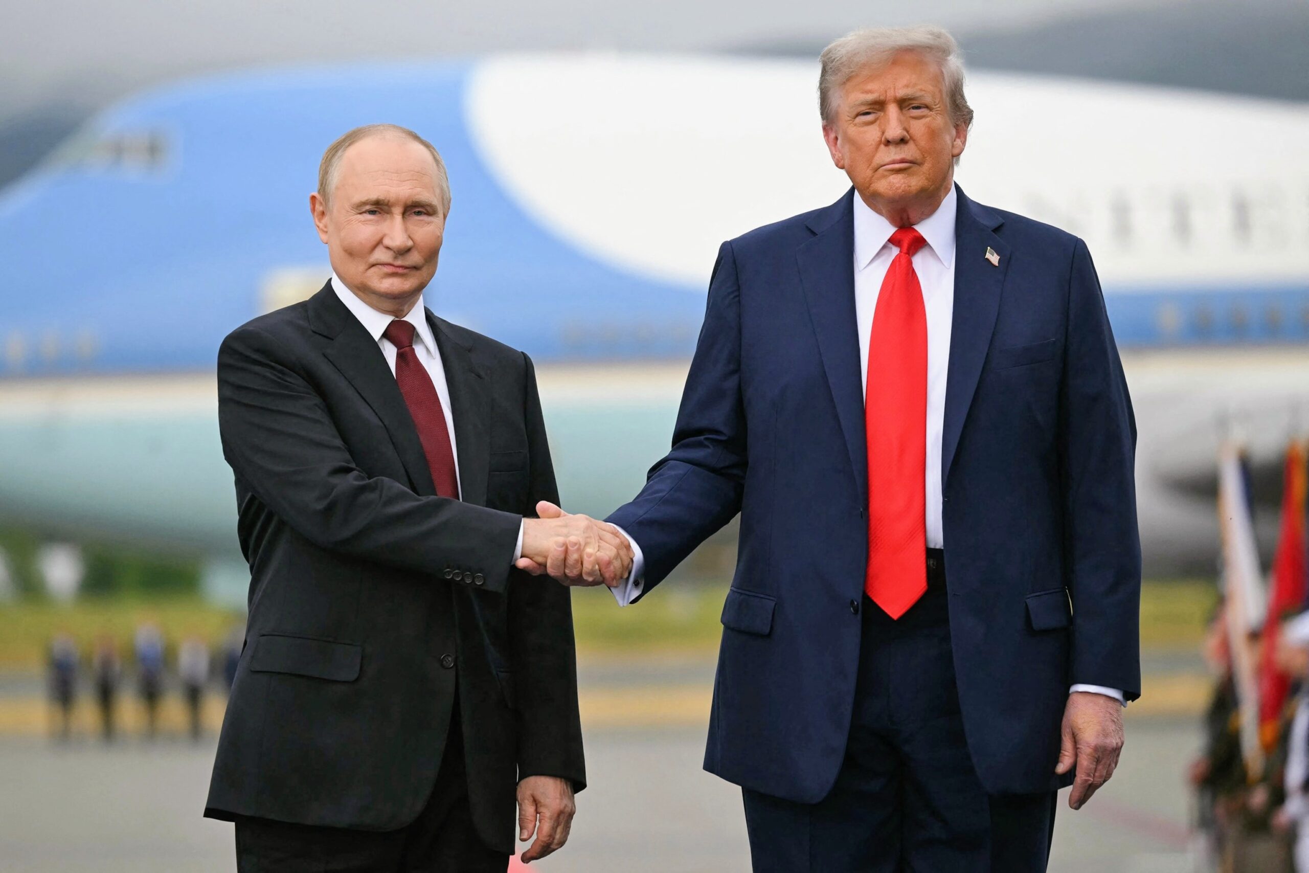 Donald Trump and Vladimir Putin walking side-by-side at the Alaska summit.