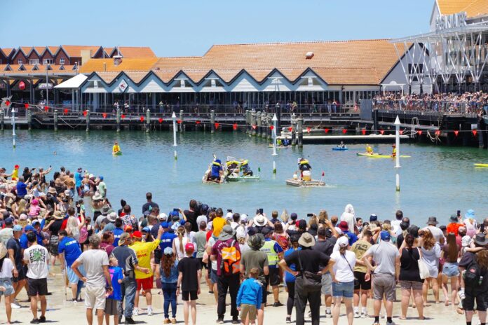 Lively crowd enjoying a waterside event at Hillarys Boat Harbour, Western Australia.