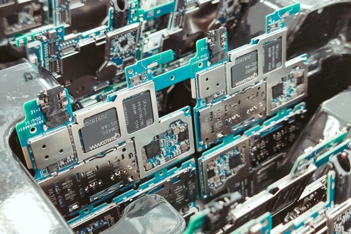 Close-up of intricate circuit boards in a Vietnamese factory, capturing modern electronics production.